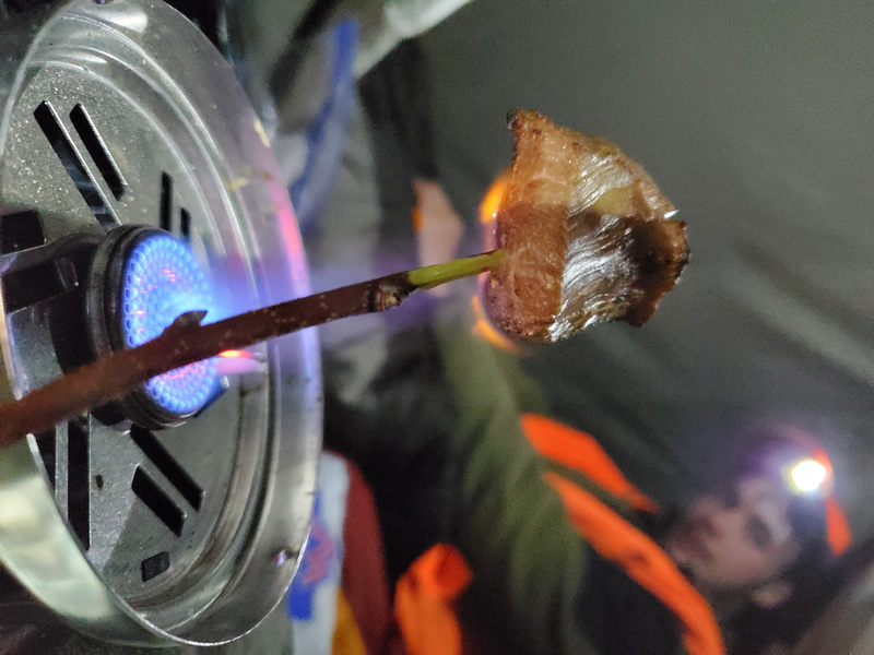 Cooking backstrap in the tent while hunting.