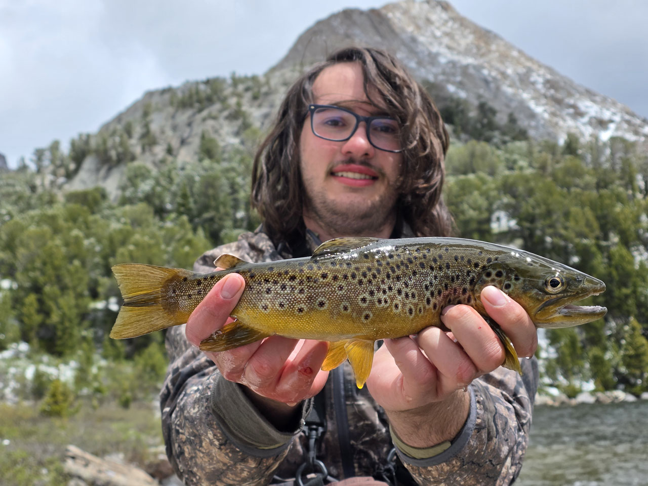 Kaden with his caught brown trout.
